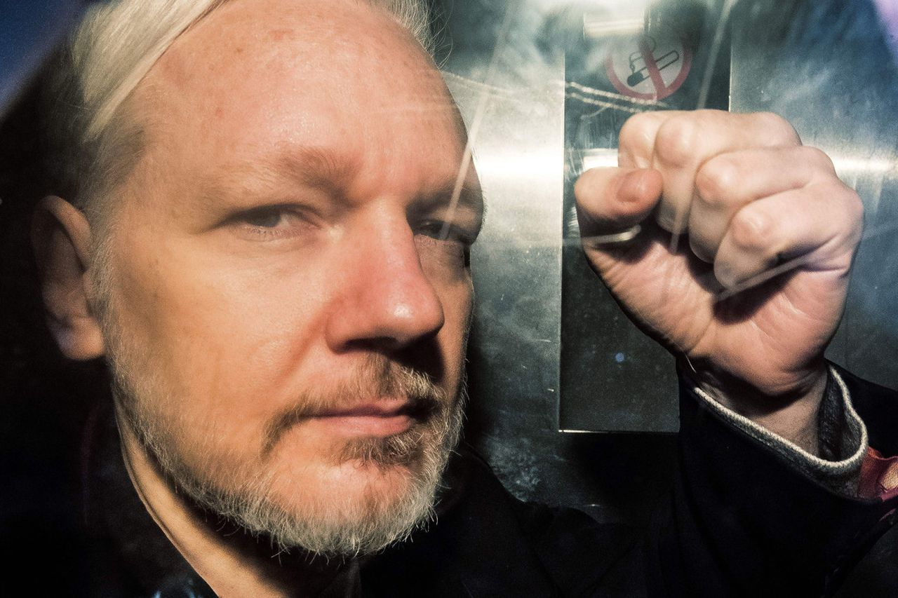 Julian Assange might die in prison, doctors say. Image via AFP.