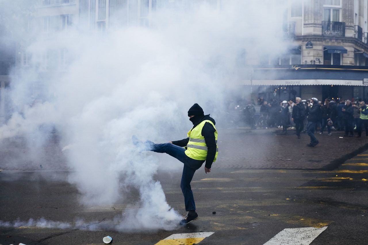 'Yellow Vest' anniversary protests face tear gas, water cannons. Image via AP.