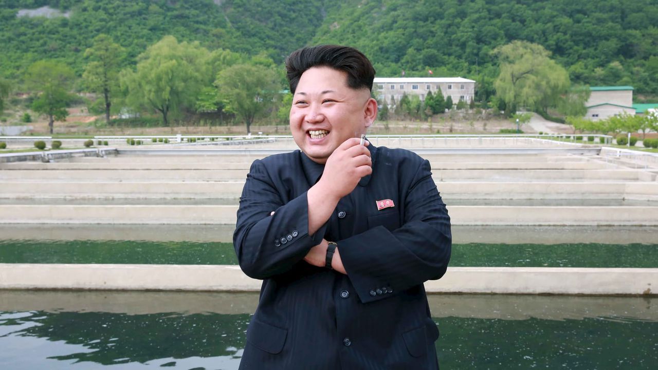 Kim Jong-Un pictured smoking and laughing at May Day celebration