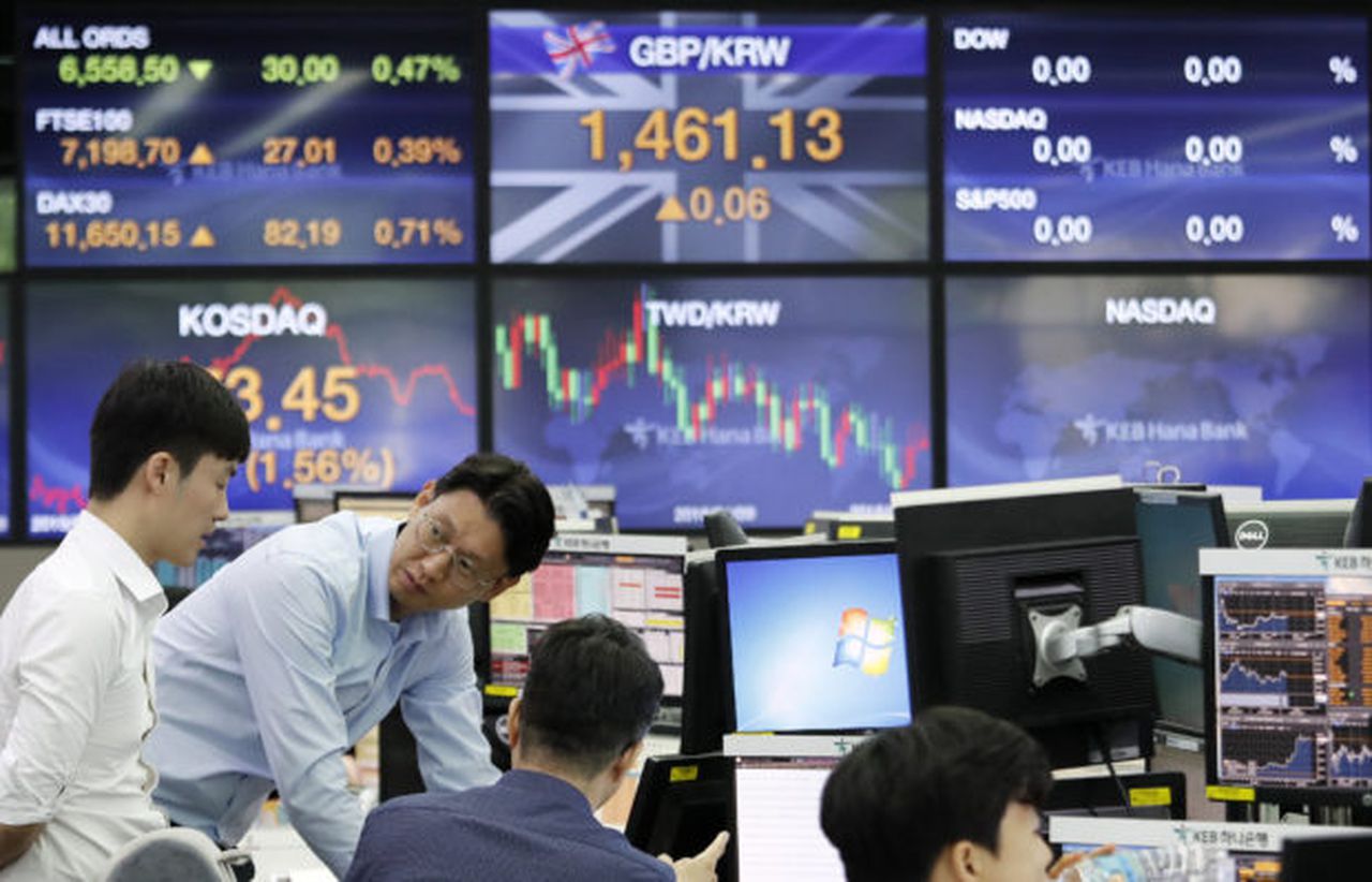 Asian markets rise despite coronavirus concerns, Image via AP