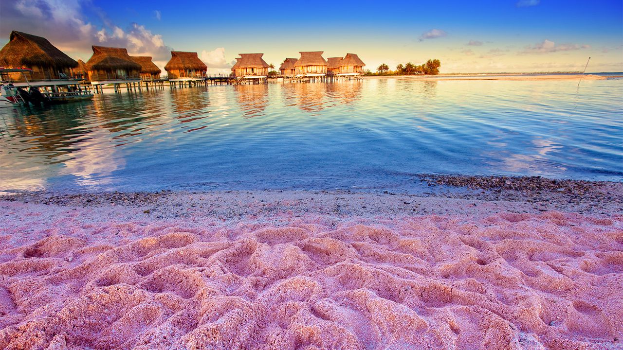 Canada's hidden natural wonder is a beach with color-shifting sands. Image via Smarter Travel.