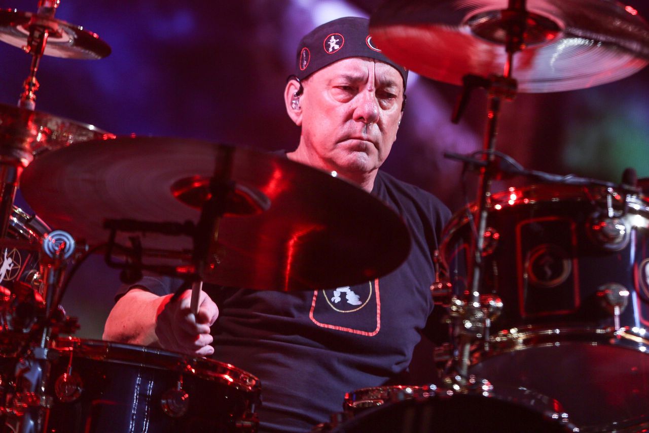 Iconic rock band Rush's drummer and sognwriter Neil Peart passes away at 67 due to brain cancer. Image via AP.