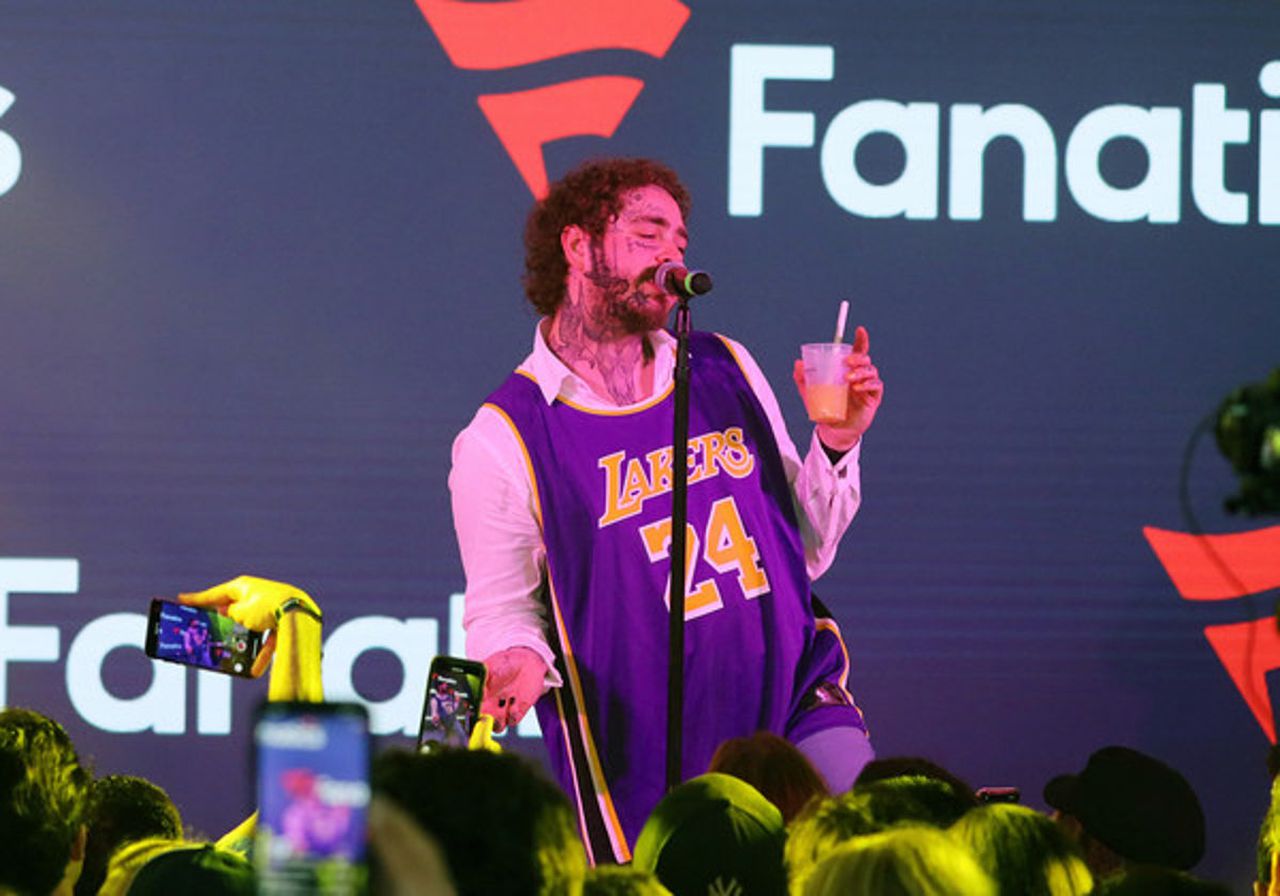 Fans worried after Post Malone stumbles and falls during onstage performance. Image via EURWeb.