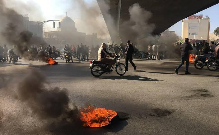 People in Iran are still protesting the rise in fuel prices, image via AFP