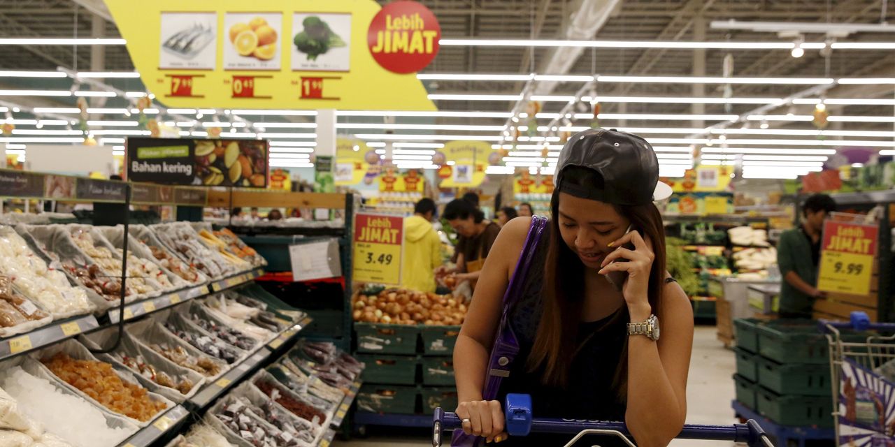 The largest British company, Tesco, might be selling off its supermarket businesses in Malaysia and Thailand. Image via Wall Street Journal.