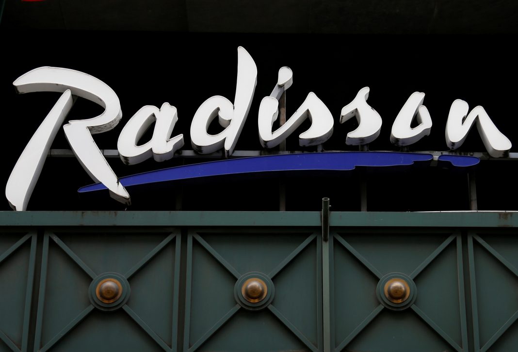 FILE PHOTO: The logo of Radisson hotel group is pictured over its main entrance in central Brussels, Belgium August 4, 2017. REUTERS/Francois Lenoir/File Photo