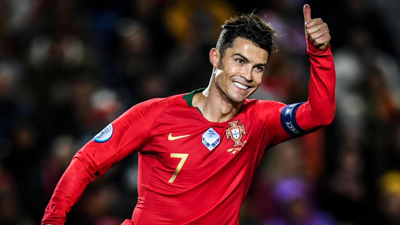 Cristiano Ronaldo reached 98 international goals with a hat-trick against Lithuania. Image via AFP.